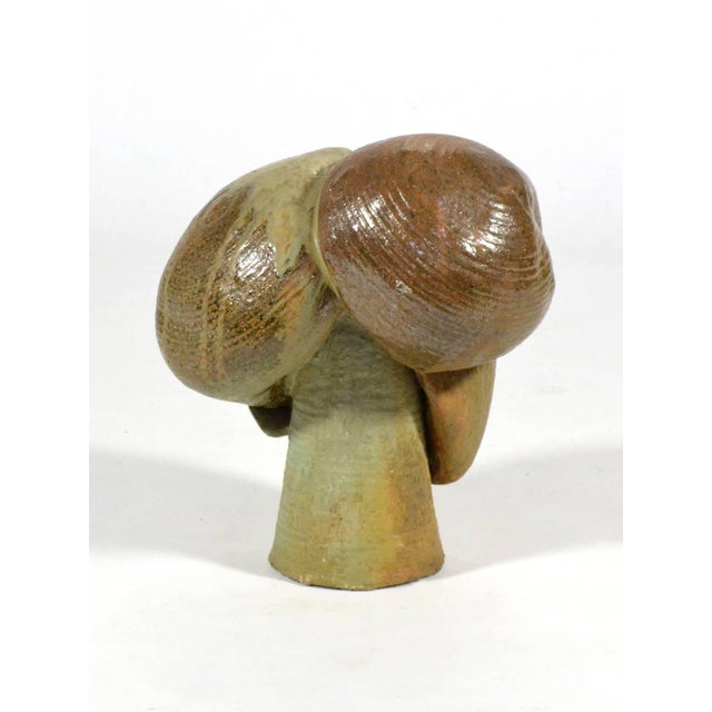 This large ceramic abstraction has a terrific form and a rich earthy texture and color. With glazes in modeled greens and...