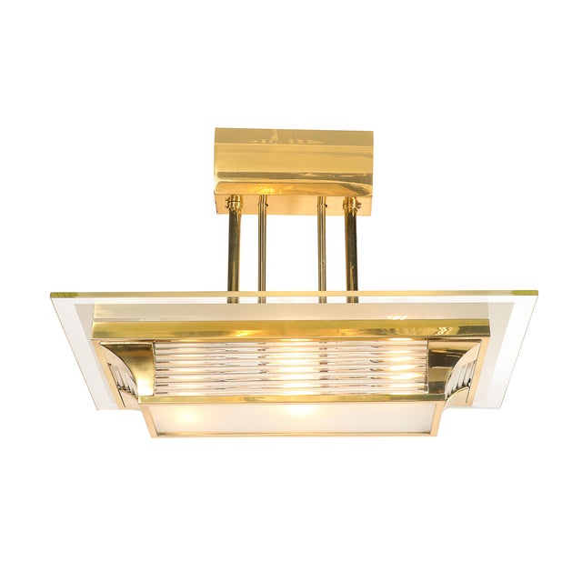 A striking Art Deco chandelier by Petitot, crafted in France circa 1935, this exceptional piece embodies the Machine Age...