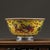 This elegant porcelain bowl features a striking bright yellow base, hand decorated with scrolling cloud motifs and...