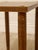A handsome vintage side table with a warm wood finish, clean rectangular top, and simple tapered legs. Small round brass-...