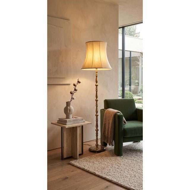 Elegant Danish floor lamp from the 1960s, crafted in brass and featuring its original shade. The lamp is in very good...