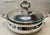 Elegant vintage silverplate casserole/serving dish with ornate lid and side handles, made by M&R English Silver Mfg Co. It...