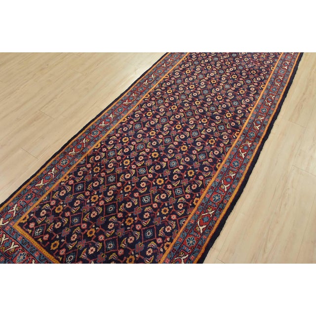 An authentic vintage traditional tribal Mahal runner hand-knotted with fine wool and natural dyes. This oriental rug...