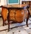 Make a sophisticated statement with this French Rococo-inspired bombe commode, featuring a beautifully curved silhouette,...