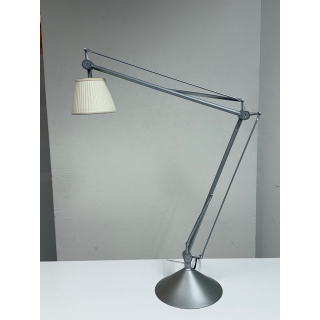 Design Plus Gallery presents the Archimoon Soft Table Lamp designed by Philippe Starck for Flos. The silver-toned aluminum...