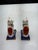 Pair of rare Staffordshire style ceramic cat figurines featuring a crackle glaze design. Decorated with red and white...