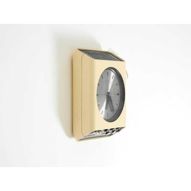 Original 1970s universum wall clock with radio. Designed by adriano rampoldi for quelle mail order (germany). Made in...