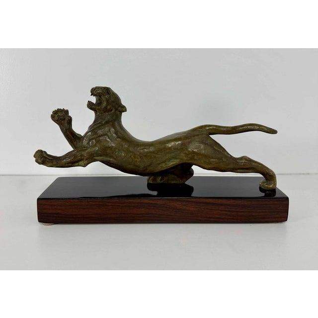 Striking French Art Deco bronze sculpture depicting a leaping panther, dating to the 1940s. The composition fully embodies...