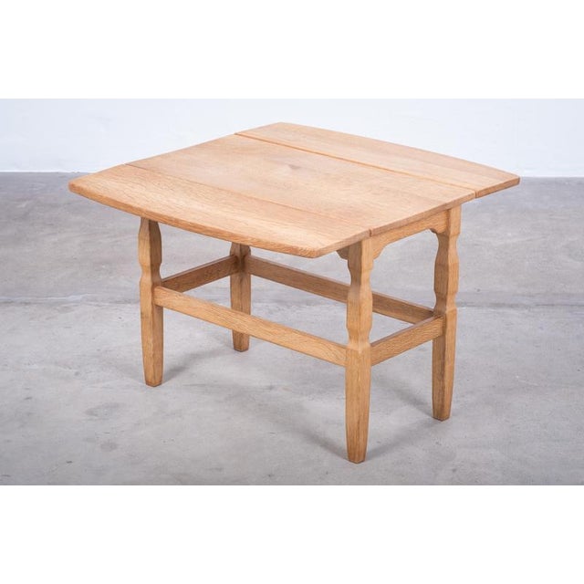 Rectangular coffee or side table in solid oak by Danish designer Henning Kjærnulf, produced in Denmark during the 1960s....
