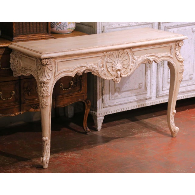 Decorate an entry hall, dining room, or den with this elegant antique wall console table crafted in the Louis XV taste...