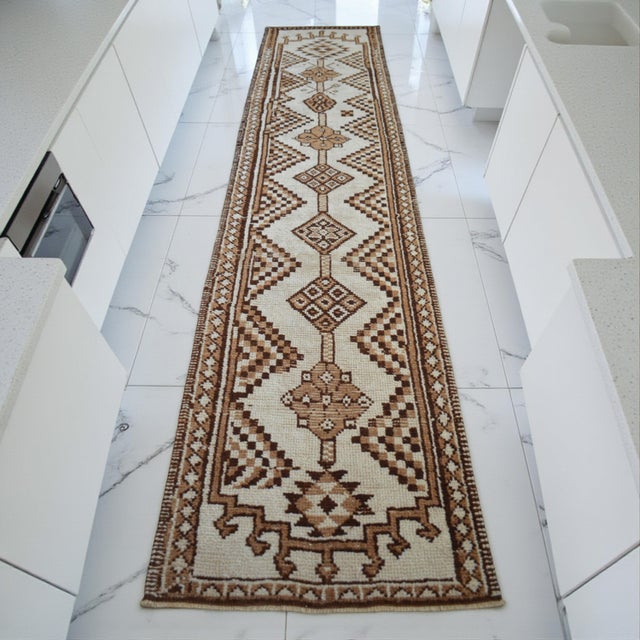 This exceptional 1970s Southeastern Anatolian runner represents the purest form of textile art, crafted entirely from...
