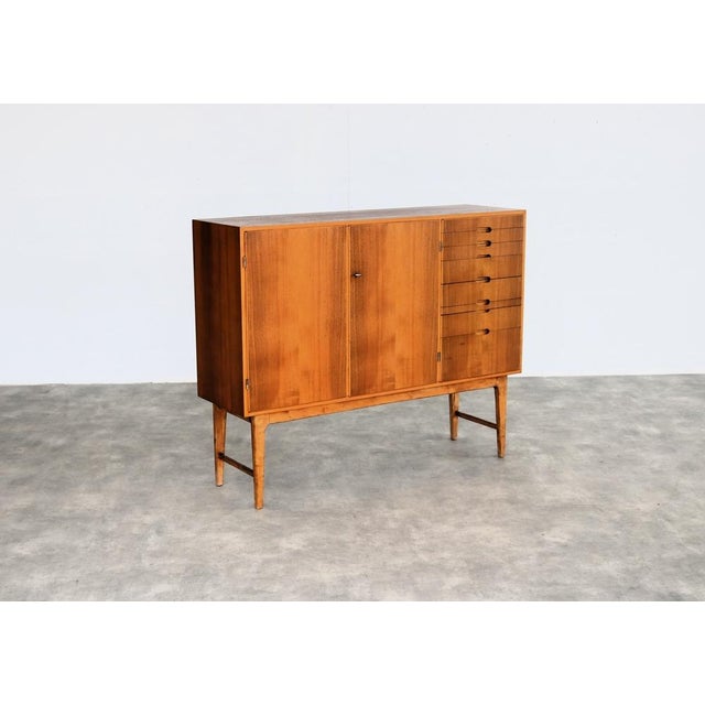 Vintage Highboard from Juryvald, 1954, in Good conditions. Designed 1950 to 1959 This piece has an attribution mark, I am...