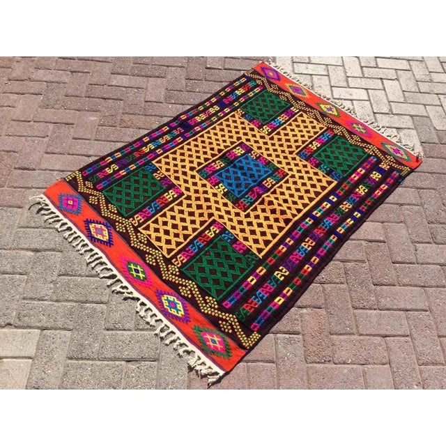 This beautiful, vintage, handwoven kilim is approximately 60 years old. It is handmade of very fine quality, hand-spun...