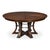 Warm brown oak and a sculptural, iron-detailed base give the expandable top a grounded presence. The deeper brown finish...