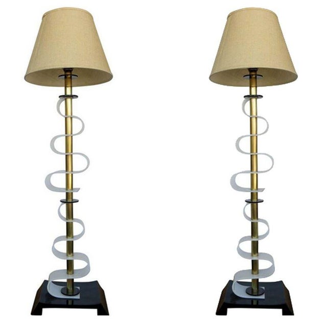 Moss Lighting Co. crafted exquisite acrylic floor lamps from 1950s in California, featuring intricate scrolling patterns....