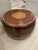 This is a Chinese-style natural wood drum coffee or side table with a stained leather top and brass nailhead trim. Hand-...