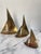 Charming collection of three brass sailboat figurines in graduated sizes. In great vintage condition with some areas of...