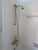 A stunning wall-mount bath and shower faucet set by Czech & Speake of London, finished in unlacquered brass with signature...