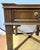 Vintage Chippendale style carved mahogany side table with a gallery top, single drawer, swan neck brass drop pull and...