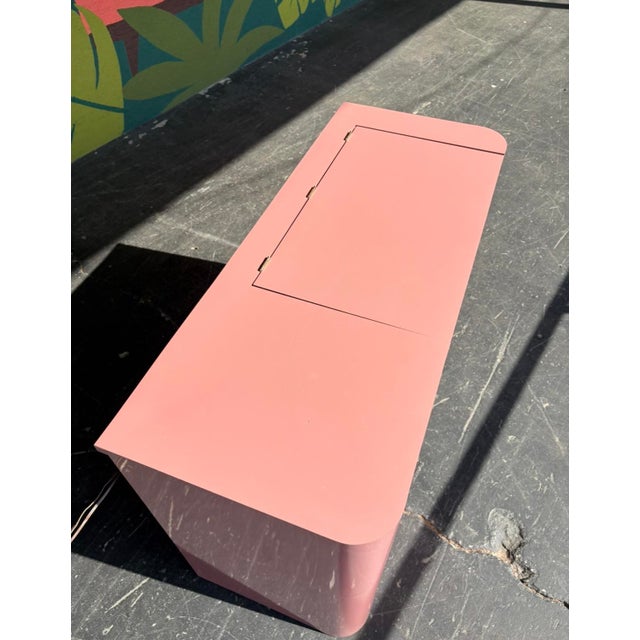 Bright and fun retro pink flip top vanity with a lighted mirror. Perfect for wherever you need to sit and appreciate...