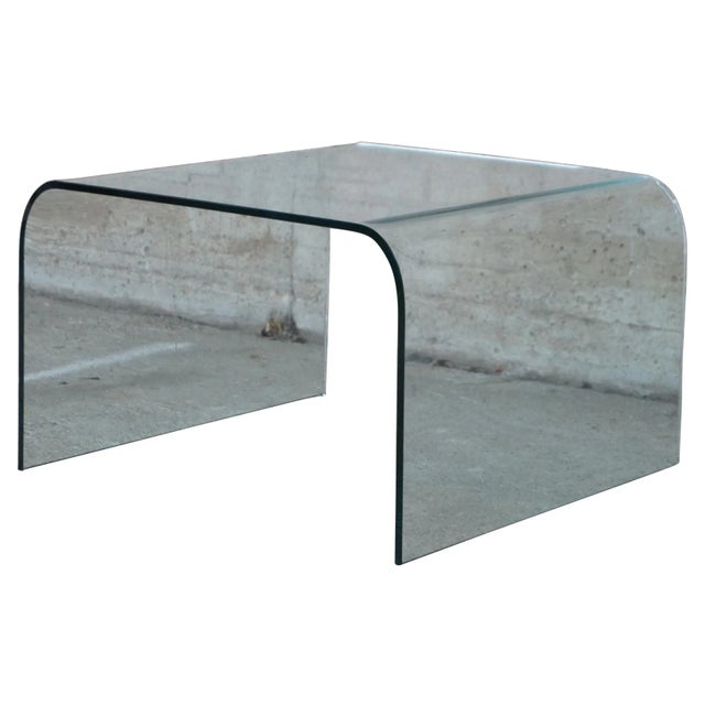 Vintage clear glass waterfall side or coffee table. Made of one single piece of glass polished on the edge.