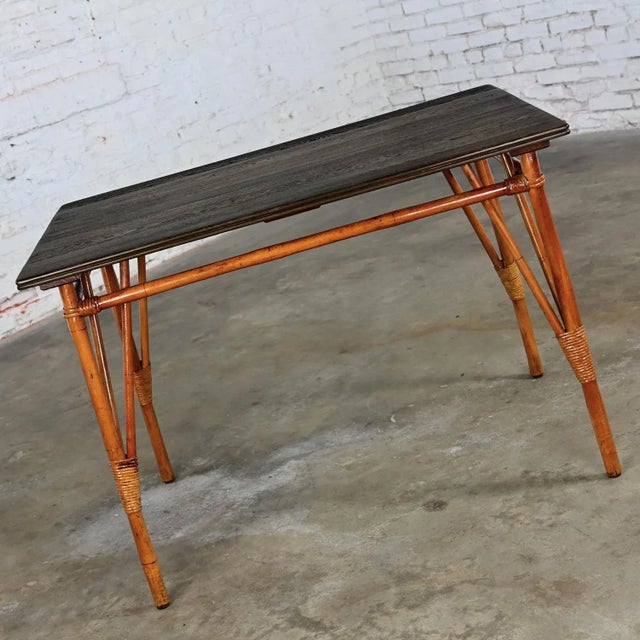 Fabulous vintage Island Style rattan dining table with ebony black stained hardwood top. Beautiful condition, keeping in...