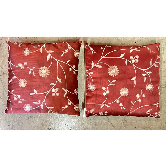 Pair of 2 decorative Rust colored Square Silk pillows. Rust Colored with White Small Decorative Floral Embroidered Pattern...