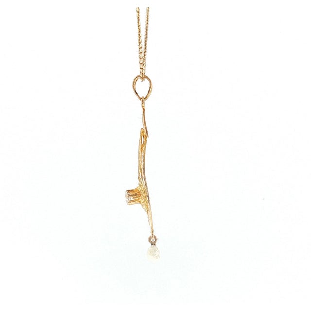 A Victorian pendant necklace crafted from 9k yellow gold. Features an Old Mine-cut diamond weighing approximately 0.09...