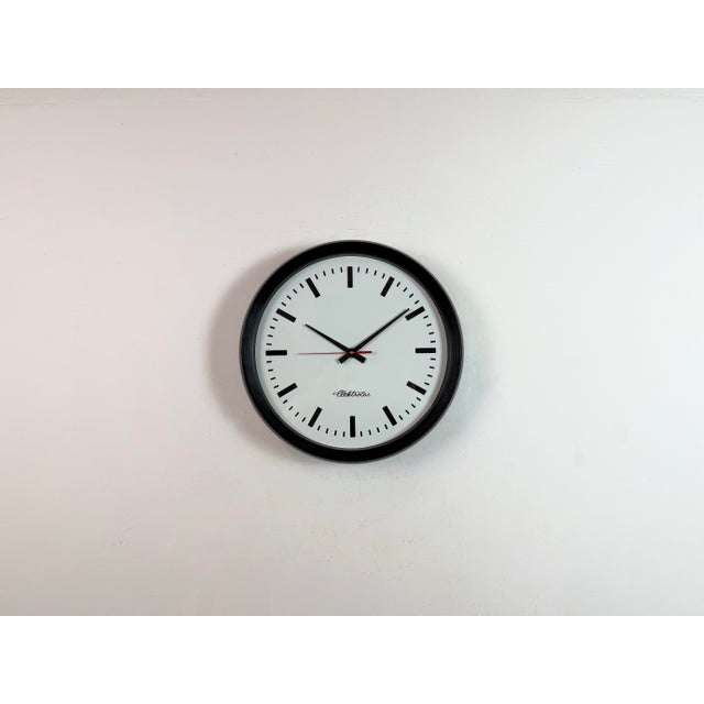 This wall clock was produced by Elektočas ( former Pragotron ) in Czech Republic during the 1990s. The piece features a...