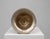 Elegant vintage silver-tone metal urn featuring a flared rim, pedestal base, and ornate decorative side handles. This...