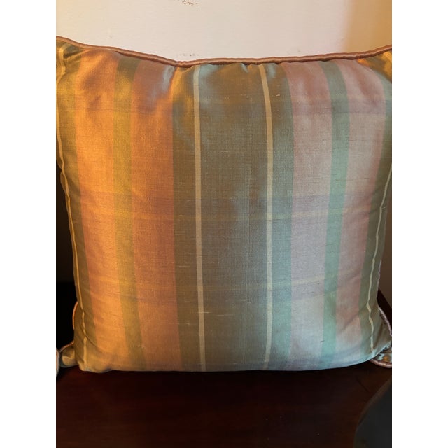 Pair of decorative silk pillows in olive, pink and beige.