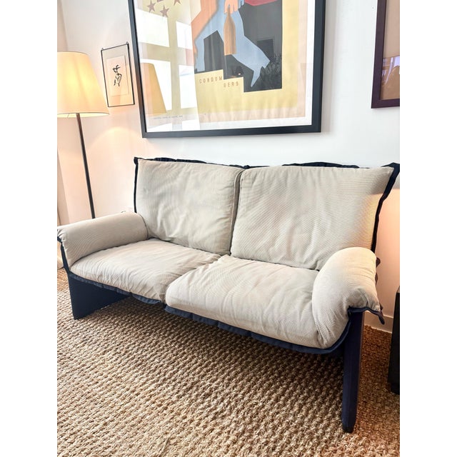 Vico Magistretti for Cassina Palmaria Loveseat Dimensions: H 35” x W 67” x D 37” x SH 18” Italy circa 1980s Beige fabric...