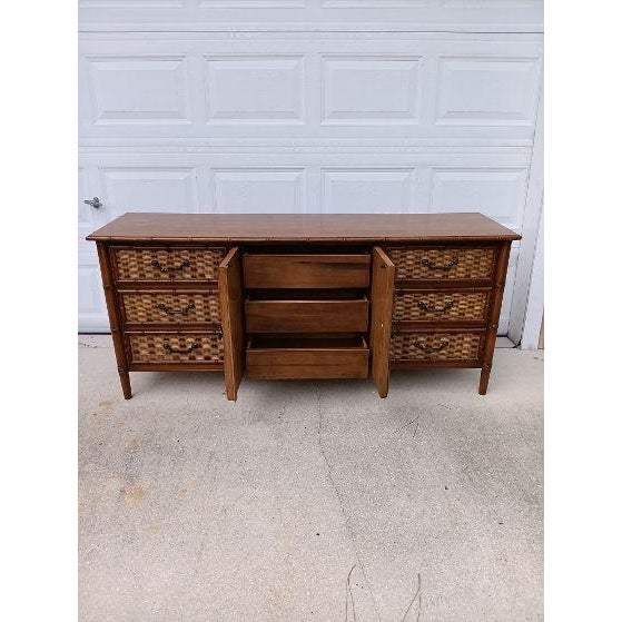 Genuine Dixie 7 Drawer Dresser Features Faux Bamboo and rattan wicker Style: Coastal Color: Brown Dimensions: 68" W x 30"...