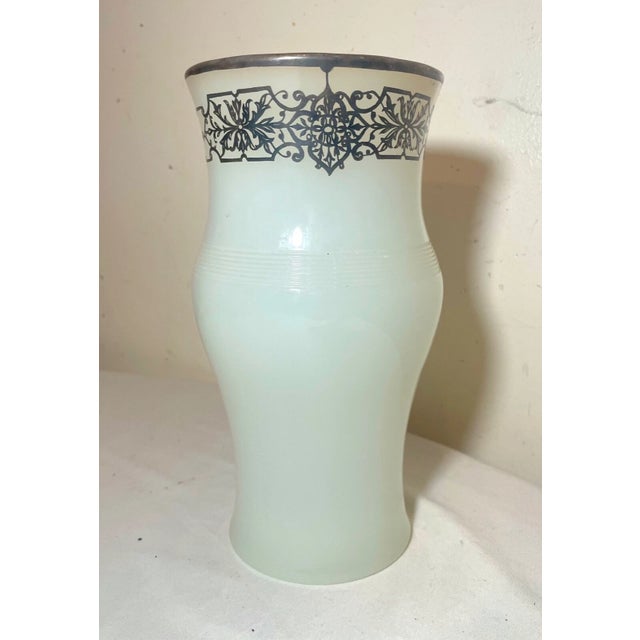 Up for sales a wonderful antique sterling silver overlaid opal glass vase. It's made of thick opal colored glass in a...