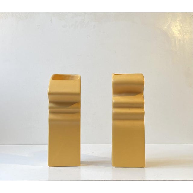 A stylish duo of two facial vases. Executed in ceramic with flat yellow glaze. Manufactured by asa in germany during the...