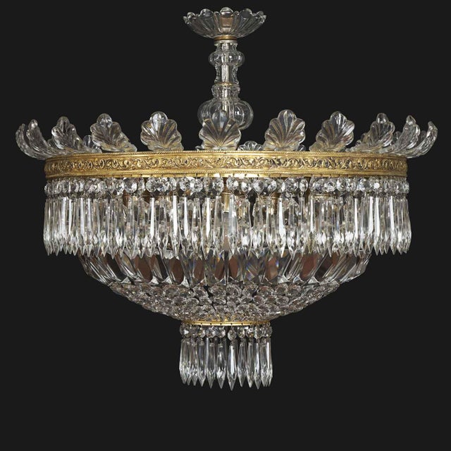 Large, five-light crystal ceiling lamp from the 1950s, enclosed within a circular crystal bowl. This circular pendant from...