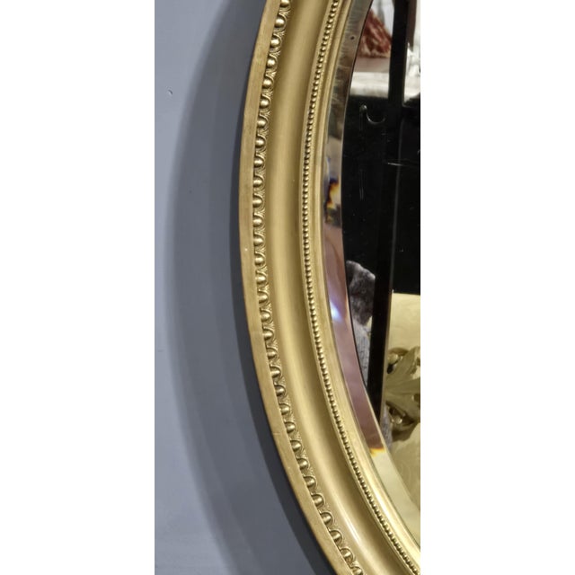 A very good Victorian oval gilt mirror, original bevelled glass, can be hung landscape or portrait, in overall great...