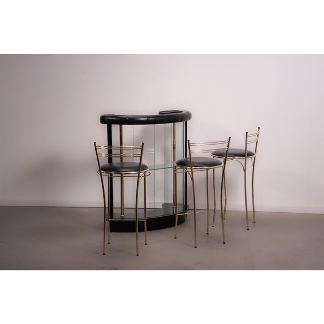 Glass and high gloss laquered hollywood regency dry bar made by Martin Spain and set of 3 Cidue bar stools. Circa 1980....