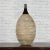 A Thai Chiang Mai contemporary ceramic black neck vase from the Prem collection with textured belly. Charming our eye with...