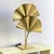 Entirely made of brass with a polished finish, this lamp with elegant curves and tropical charm is equipped with two...