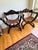 Vintage Renaissance Revival Savonarola Chair with Leather Sling Seat. Hand-carved solid wood frame featuring heraldic...