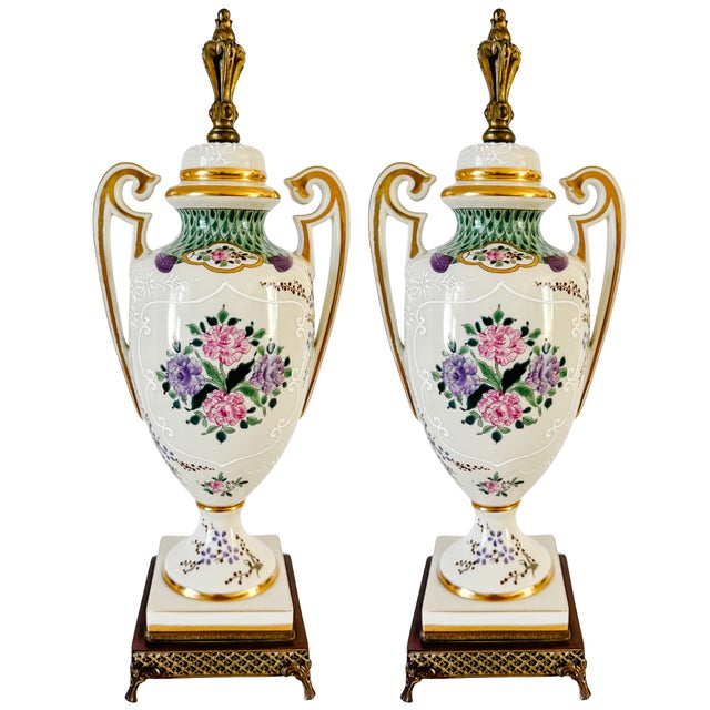 An exquisite pair of late 19th-century French Samson & Cie porcelain covered urns, masterfully hand-painted in the 18th-...