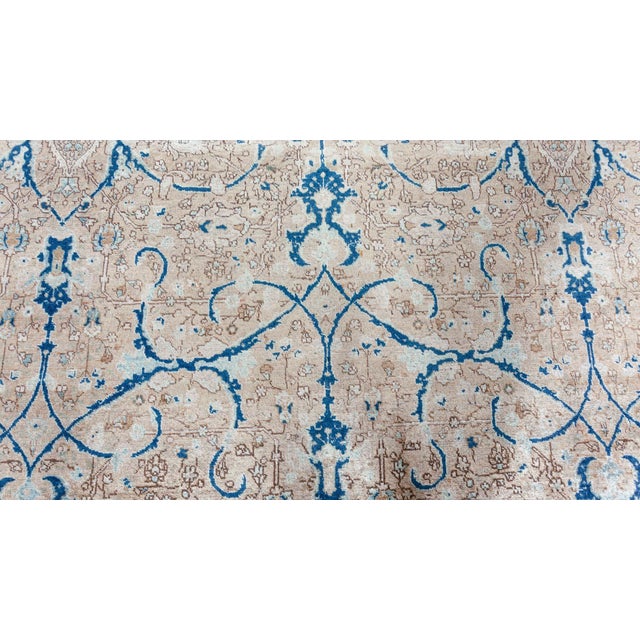 A hand-knotted wool antique Persian Tabriz rug dating back to 1920. The beige field is covered with brown, delicate...