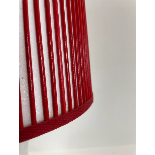 Solid red sticks are added by hand, one at a time, over artisanal, vellum paper. This Stick Shade will add charm to any...