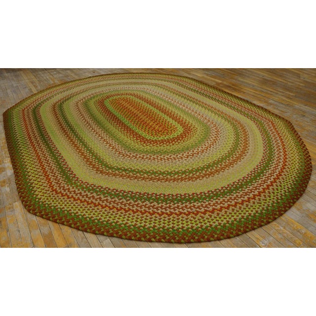 Mid 20th Century American Braided Rug ( 9' x 12' 6" - 275 x 381 cm) Vintage Braided Room Size Wool Multi Rug, Circa Date:...