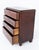 An elegant Biedermeier mahogany chest of drawers of rounded-corner form, raised upon turned feet The chest features a...