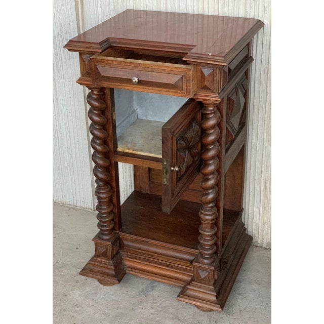 19th century pair of solid carved Brutalist French nightstands with Solomonic columns it has one drawer and one...