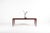 This stunning rosewood coffee table was designed by Johannes Andersen for CFC Silkeborg in Denmark. It features an...