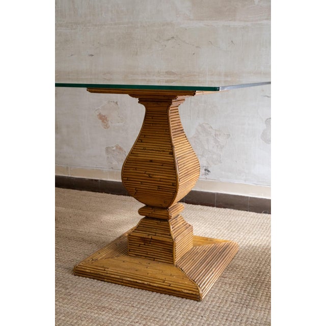 Dining table by Vivai del Sud, made in the 1970s. Double shaped base entirely covered in rattan, with horizontal canework...