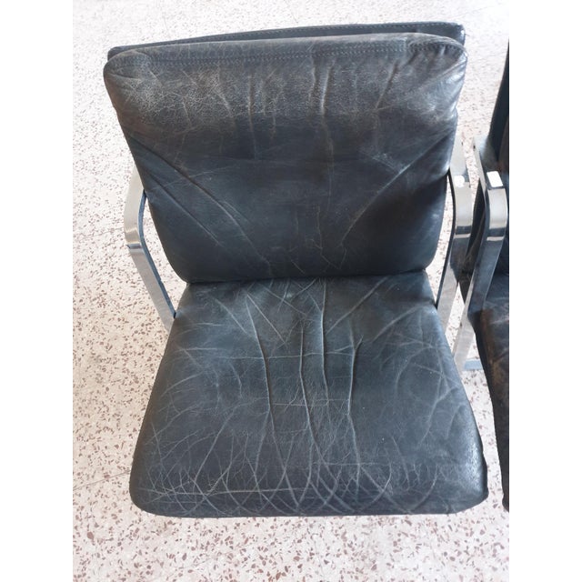 Beautiful 4 fine design armchairs in steel and leather 1970s.